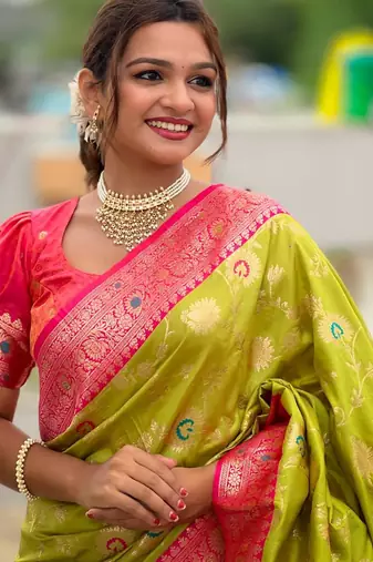 Green elegant art silk woven saree with rich zari border