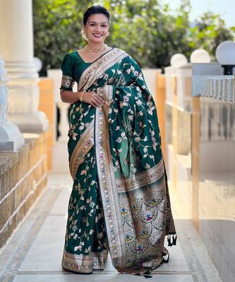 Green elegant art silk woven saree with rich zari border 1