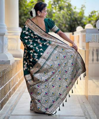 Green elegant art silk woven saree with rich zari border 2