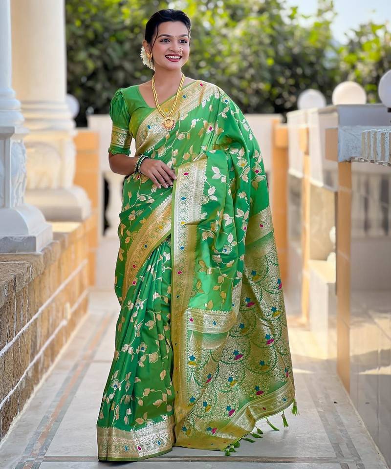 Green elegant art silk woven saree with rich zari border