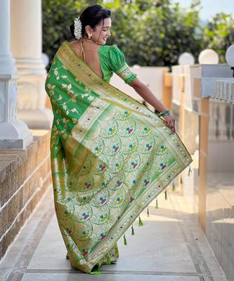 Green elegant art silk woven saree with rich zari border 2