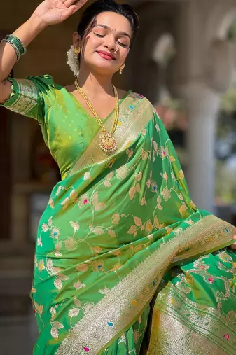 Green elegant art silk woven saree with rich zari border
