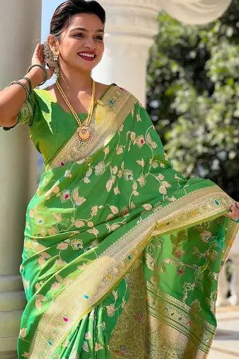 Green elegant art silk woven saree with rich zari border
