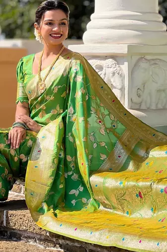 Green elegant art silk woven saree with rich zari border