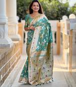 Green elegant art silk woven saree with rich zari border