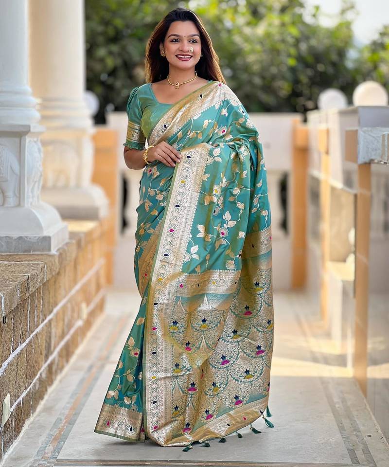Green elegant art silk woven saree with rich zari border