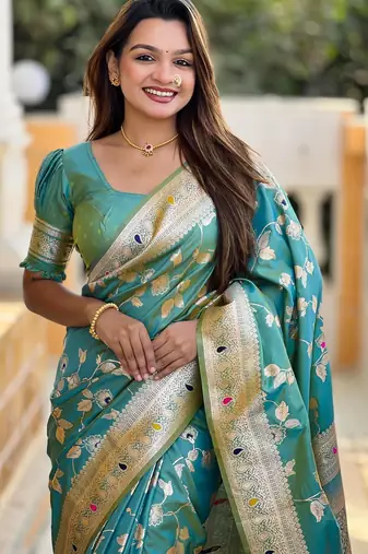 Green elegant art silk woven saree with rich zari border
