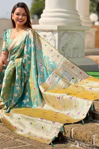 Green elegant art silk woven saree with rich zari border