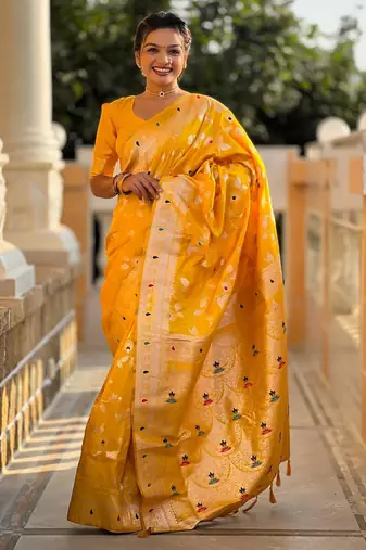 Yellow elegant art silk woven saree with rich zari border