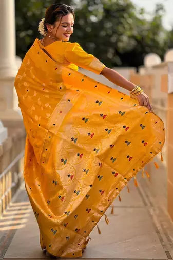 Yellow elegant art silk woven saree with rich zari border