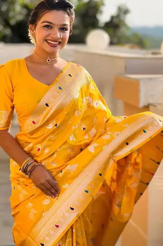 Yellow elegant art silk woven saree with rich zari border