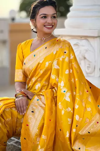 Yellow elegant art silk woven saree with rich zari border