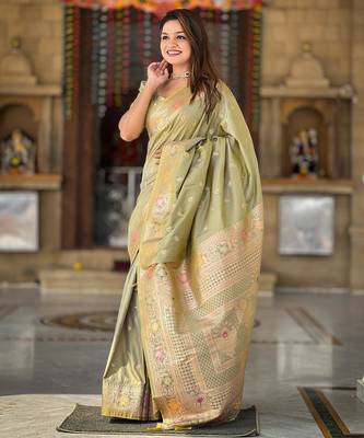 Green elegant art silk woven saree with rich zari border 1