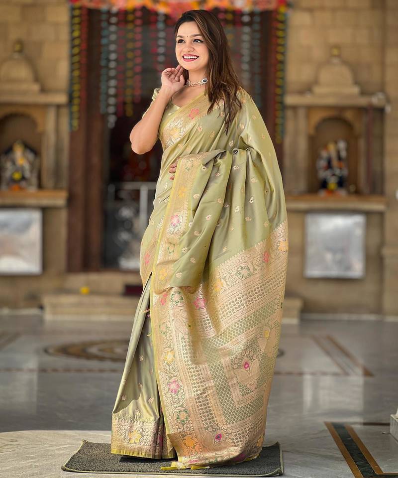Green elegant art silk woven saree with rich zari border