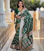 Green elegant art silk woven saree with rich zari border