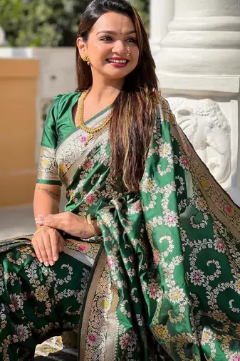 Green elegant art silk woven saree with rich zari border