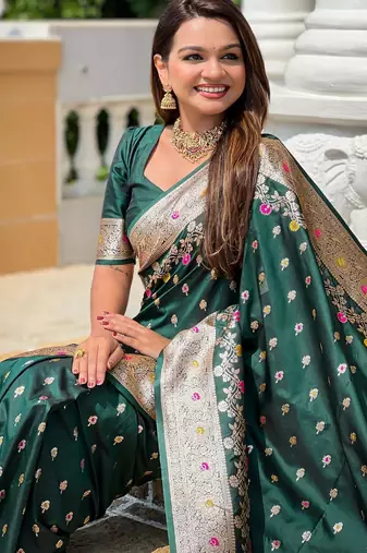 Green elegant art silk woven saree with rich zari border