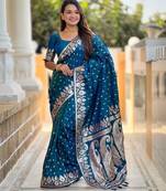 Turquoise elegant art silk woven saree with rich zari border