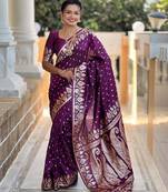 Wine elegant art silk woven saree with rich zari border