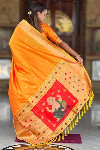 Orange elegant art silk woven saree with rich zari border