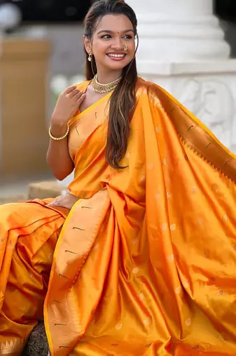 Orange elegant art silk woven saree with rich zari border