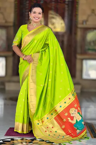 Green elegant art silk woven saree with rich zari border
