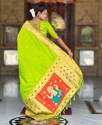Green elegant art silk woven saree with rich zari border 2