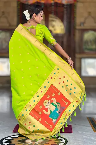 Green elegant art silk woven saree with rich zari border