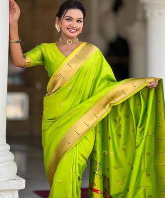 Green elegant art silk woven saree with rich zari border 3