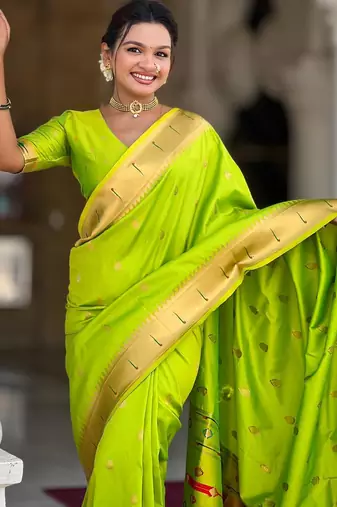 Green elegant art silk woven saree with rich zari border