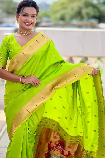 Green elegant art silk woven saree with rich zari border