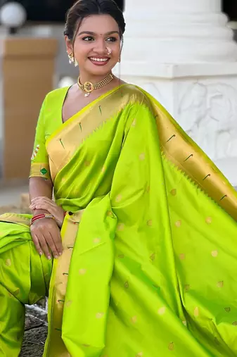 Green elegant art silk woven saree with rich zari border