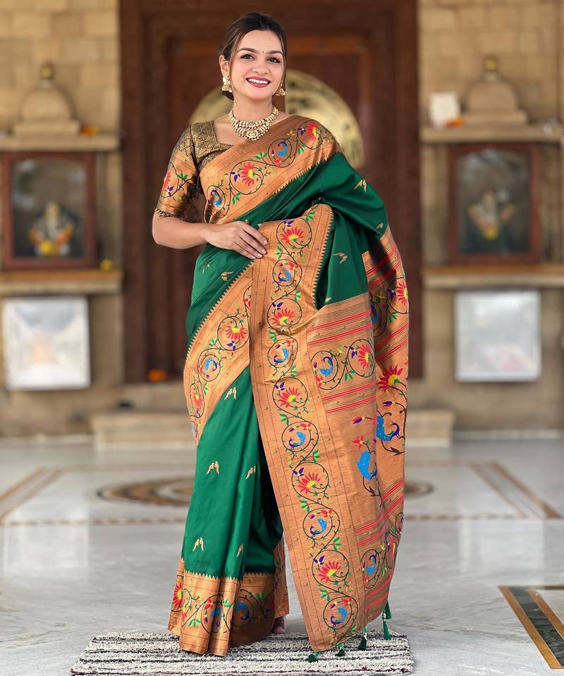 Green elegant art silk woven saree with rich zari border