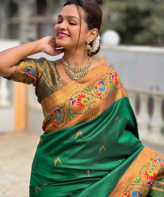 Green elegant art silk woven saree with rich zari border 2