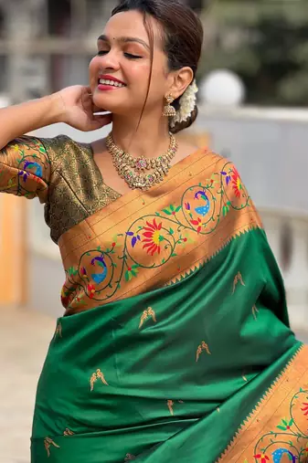 Green elegant art silk woven saree with rich zari border