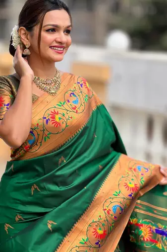 Green elegant art silk woven saree with rich zari border