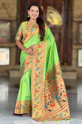 Green elegant art silk woven saree with rich zari border