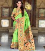 Green elegant art silk woven saree with rich zari border