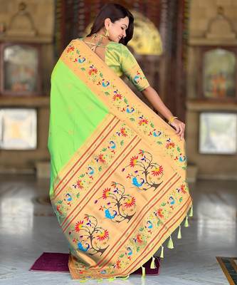 Green elegant art silk woven saree with rich zari border 2