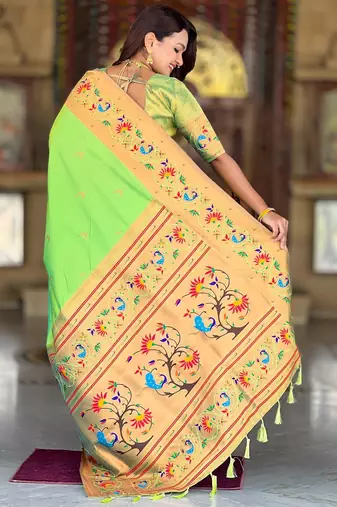 Green elegant art silk woven saree with rich zari border