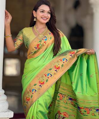 Green elegant art silk woven saree with rich zari border 3