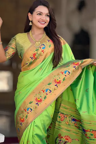 Green elegant art silk woven saree with rich zari border