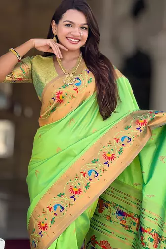 Green elegant art silk woven saree with rich zari border