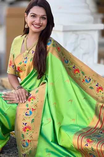 Green elegant art silk woven saree with rich zari border
