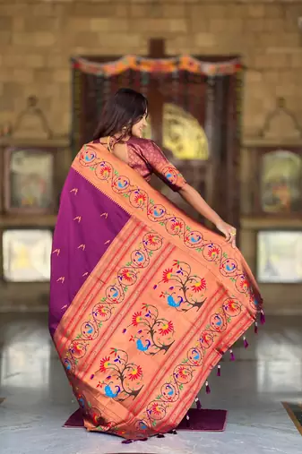 Wine elegant art silk woven saree with rich zari border