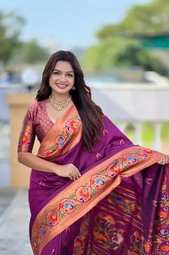Wine elegant art silk woven saree with rich zari border