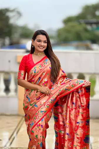 Orange elegant art silk woven saree with rich zari border