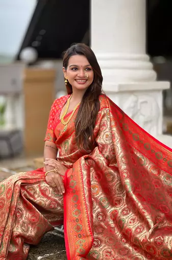 Red elegant art silk woven saree with rich zari border