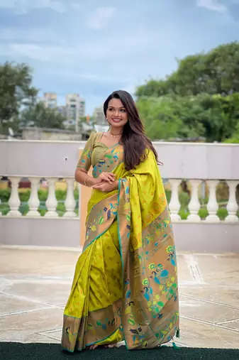 Green elegant art silk woven saree with rich zari border