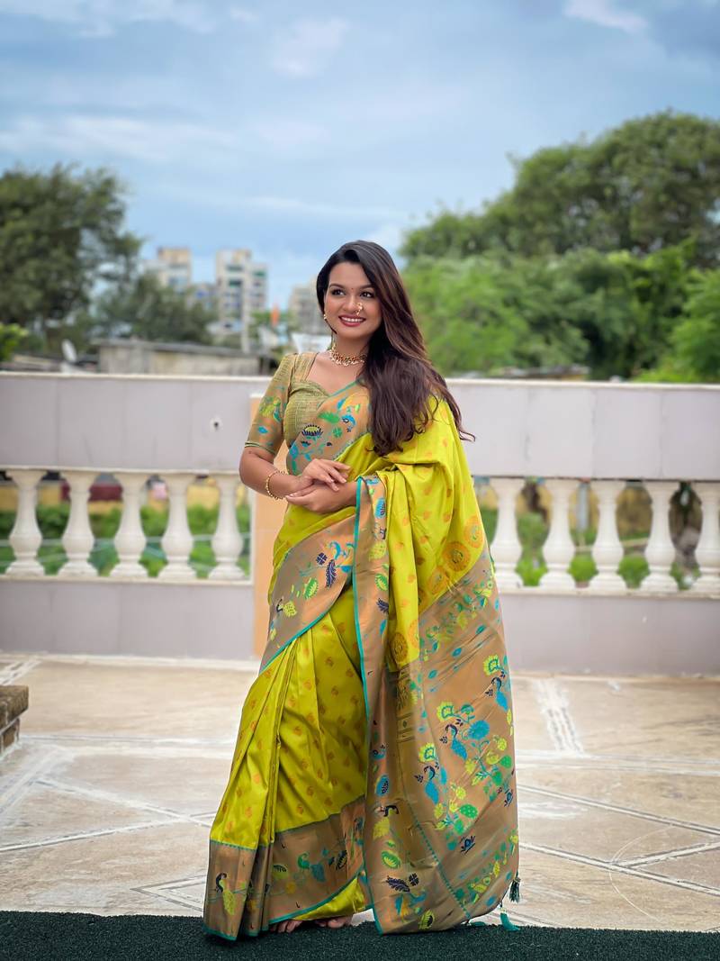 Green elegant art silk woven saree with rich zari border